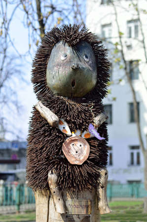 hedgehog sculpture made of wood and screwsの写真素材