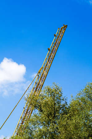 Construction site with move cranes on blue sky backgroundの写真素材