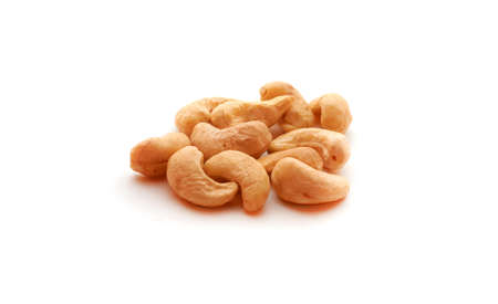 Cashew nuts heap on white backgroundの写真素材