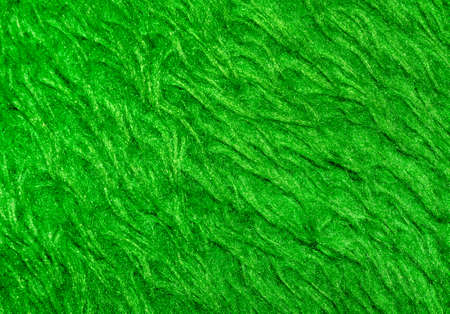 Green wool with top texture background. Texture of fluffy fur for designers. Close-up fragment carpetの写真素材