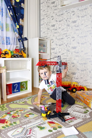 The child plays in a childs roomの写真素材