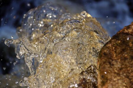 waterfall cascade falling on the rocks close upの写真素材