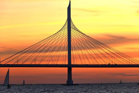 observation deck on the square with a view of the cable-stayed bridge and sunsetの写真素材