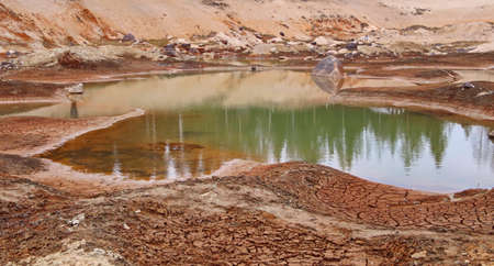 Dirty bottom of a dried-up lake. Ecological problems.の写真素材