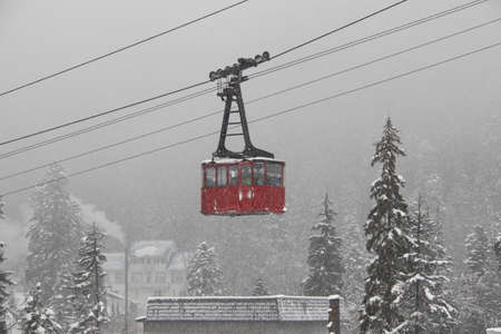 Cableway in the strong snowfall in the mountains of the Caucasusの写真素材