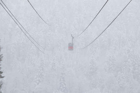 Cableway in the strong snowfall in the mountains of the Caucasus