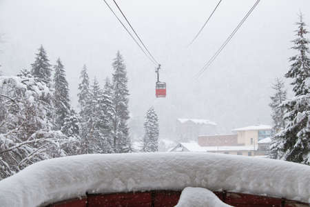 Cableway in the strong snowfall in the mountains of the Caucasusの写真素材