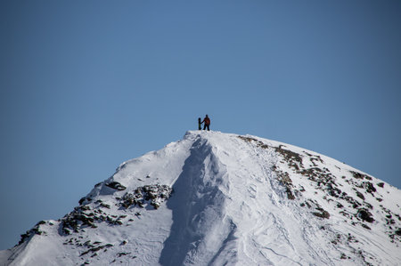man with snowboard at the top of the snowy Caucasian mountainの写真素材