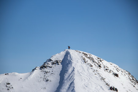 man with snowboard at the top of the snowy Caucasian mountainの写真素材