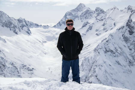 Portrait of a man on top of a snowy mountain.の写真素材