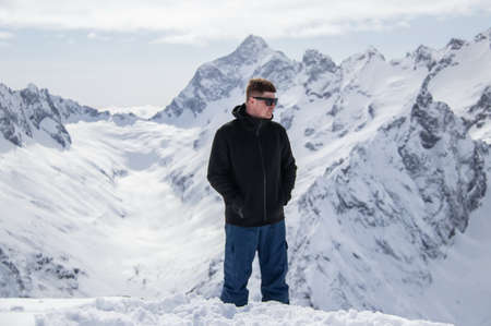 Portrait of a man on top of a snowy mountain.の写真素材