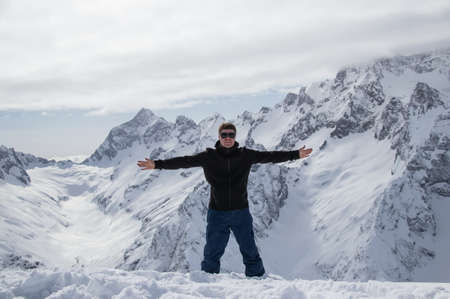 Portrait of a man on top of a snowy mountain.の写真素材