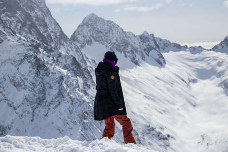 Portrait of a girl on top of a snowy mountain.の写真素材