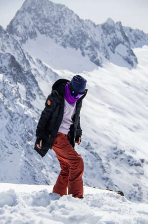 Portrait of a girl on top of a snowy mountain.の写真素材