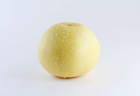 Grapefruit with water drops on white backgroundの写真素材