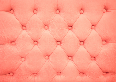 Vintage ping leather upholstery buttoned sofa backgroundの写真素材