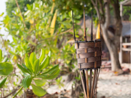 Torch without flame on the beach with blurry background, selective focusの写真素材