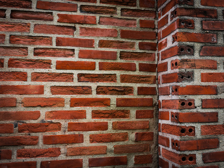 Old brick wall and corner of post for backgroundの写真素材