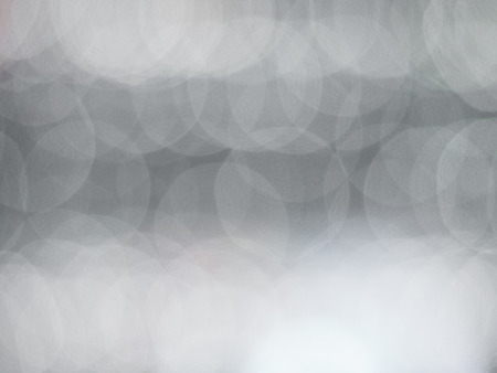abstract background with white bokeh defocusedの写真素材