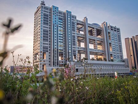 ODAIBA, TOKYO, JAPAN - MARCH 30, The Fuji Television Building at Odaiba, Tokyo at sunset scene. An outstanding architecture design of this building is one of the famous landmarks for touristのeditorial素材