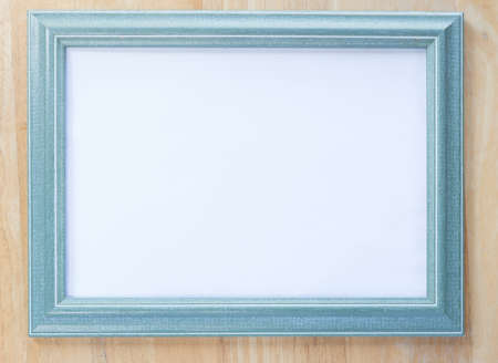Blue wooden frame on wooden backgroundの写真素材
