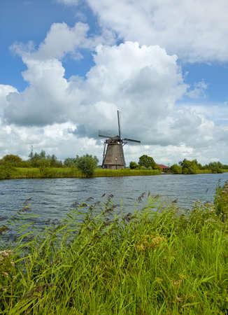 One of the very old windmills in Kinderdijk of Netherlands, the famous landmark of Holland の写真素材