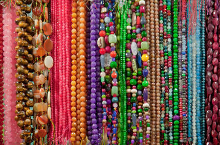 Strings of colorful semiprecious beads and gemstones 
