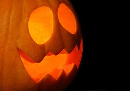 Smiling Jack-o Lantern carved for Halloween night.の写真素材