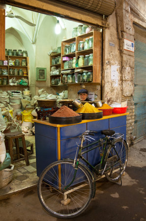 TEHRAN, IRAN - MARCH 24, 2013: Unknown old man sells spices in traditional Grand Bazaar of Tehran, which is a historical market and one of the important tourist attractions of Tehran.のeditorial素材