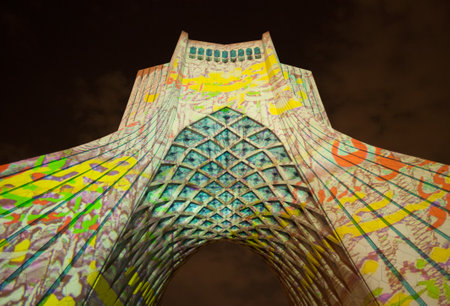 TEHRAN, IRAN - OCTOBER 4, 2015: Light Concert entitled Gate of Words projected on Azadi Monument. The Light Show was designed by Philipp Geist exclusively for this landmark of Tehran.のeditorial素材