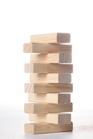 tower made with wooden blocks isolated on white background with copy spaceの写真素材