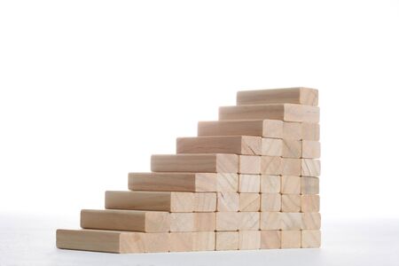 stairs build with wooden blocks on grey backgroundの写真素材