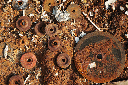 Used hand grinder metal grinding discs at trash dumpの写真素材