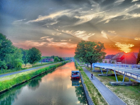Dramatic Sky over a Canal with a yachtの素材