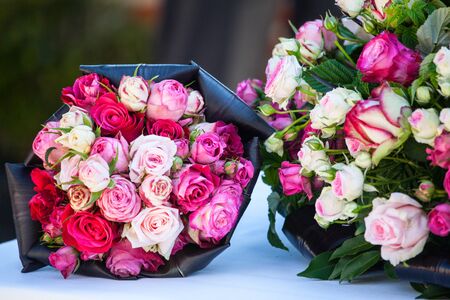 Floral decorations with different sorts of flowers, roses, tulips, and othersの写真素材