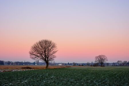 Colorful countryside sunset showing the dramatic sky around duskの写真素材