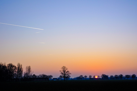 Colorful countryside sunset showing the dramatic sky around duskの写真素材