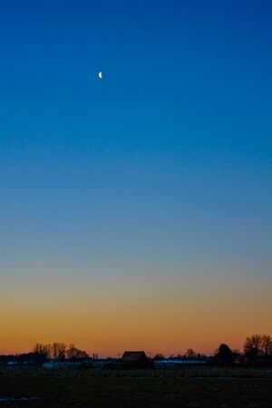 Colorful countryside sunset showing the dramatic sky around duskの写真素材