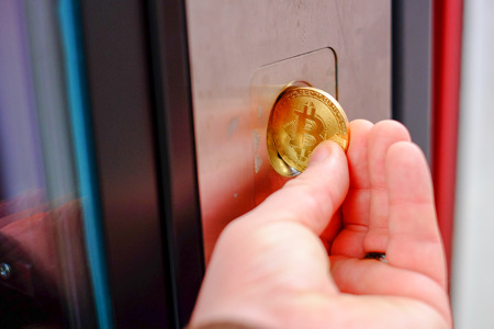 Bitcoin payment at a vending machine using cryptocurrency in real life conceptの写真素材