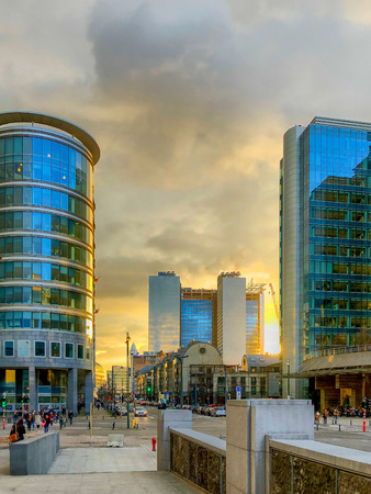 Colorful and dramatic sunrise or sunset over the financial business district of the city of...
