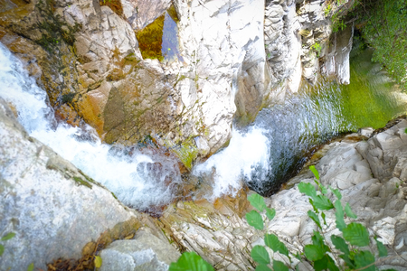 Water from a spring in the forests flowing down from the mountains in the Ardeche area in Franceの写真素材