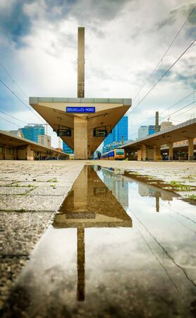 Brussels, Belgium June 2019: Commuters waiting on the platform next to the empty rails in the Brussels North railway stationのeditorial素材
