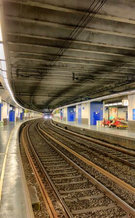 Empty railroad and platform of the Brussels-Luxembourg railway station in the European center of Brusselsのeditorial素材