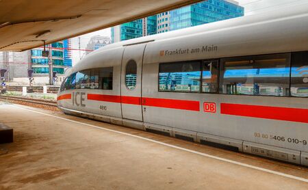 Brussels, Belgium - June 2018: ICE train between Netherlands and Germany at a platform in the Brussels North railway station, showing the office buildings of the city in the background behind the high speed trainのeditorial素材