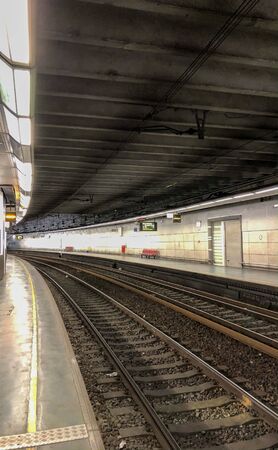 Empty railroad and platform of the Brussels-Luxembourg railway station in the European center of Brusselsのeditorial素材