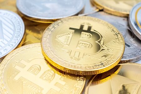 Bunch of Crypto currency coins with various of shiny silver and golden physical cryptocurrencies...