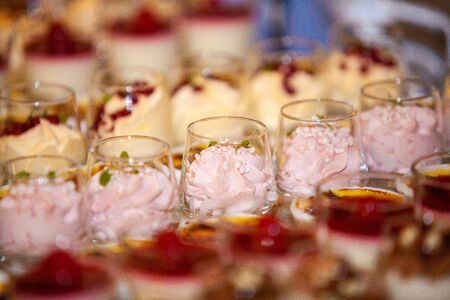 Colorful and Decorative Desserts And Pastry with fruits, mousse, biscuits Served On A Wedding Partyの写真素材