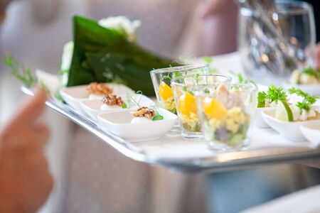 Tasty and colorful appetizers being served on a plate on a partyの写真素材