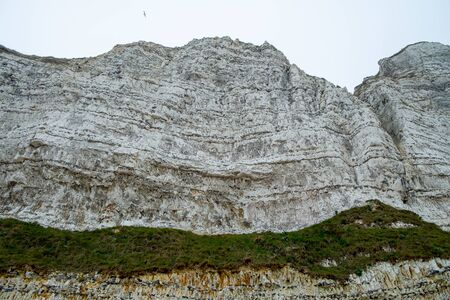 Misty morning landscape of the Natural white chalk cliffs in Etretat, Normandy, France, La Manche or English Channel, on the Coast of the Pays de Caux area.の写真素材
