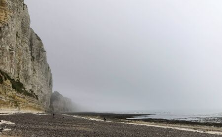 Misty morning landscape of the Natural white chalk cliffs in Etretat, Normandy, France, La Manche or English Channel, on the Coast of the Pays de Caux area.の写真素材